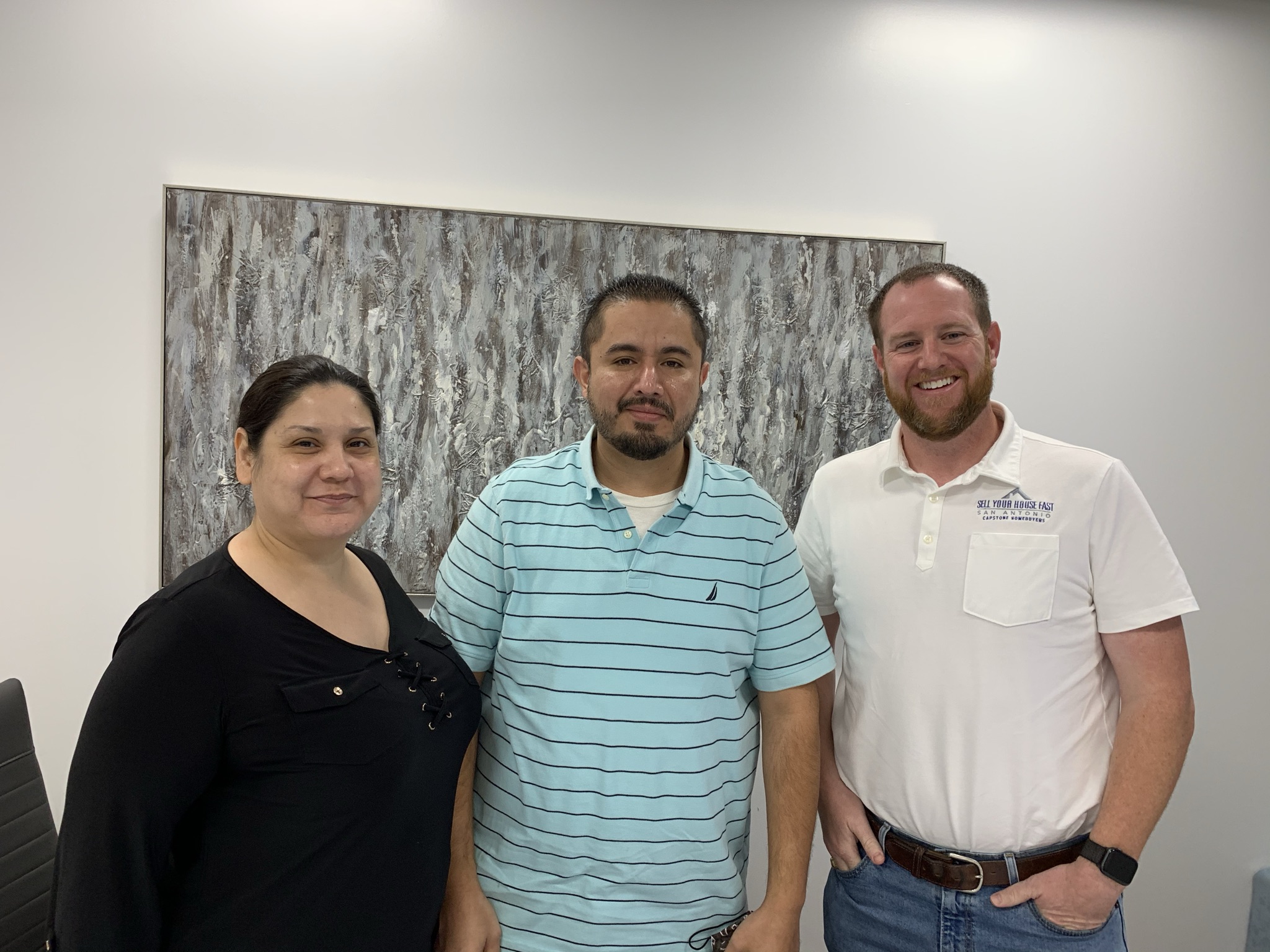 Colby Hager with two sellers after a closing