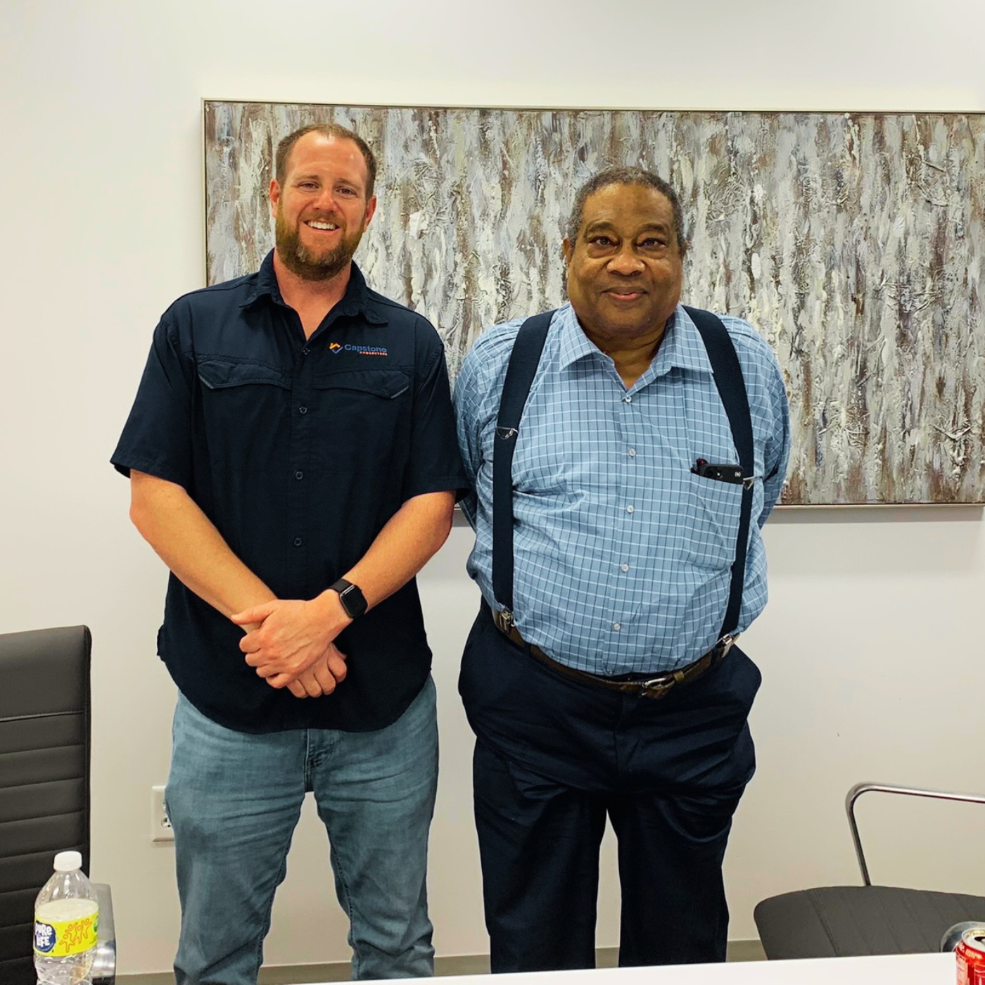 Colby Hager with a seller at the title company